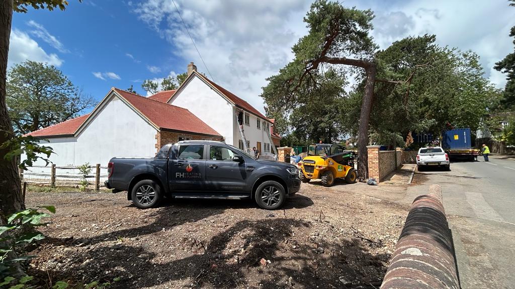 a van parked outside a house under construction