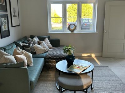 a living room with a sofa and coffee table