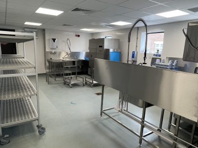 a commercial kitchen with stainless steel appliances and counters