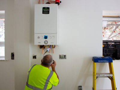 plumbing engineer working on a boiler