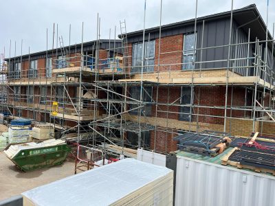 a shot of a construction site showing a building with scaffolding