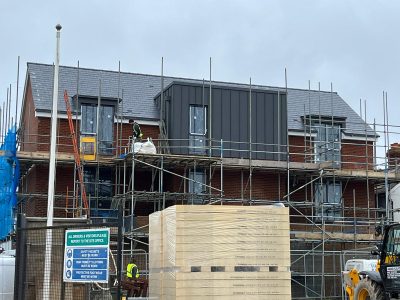 a shot of a construction site showing building with scaffolding